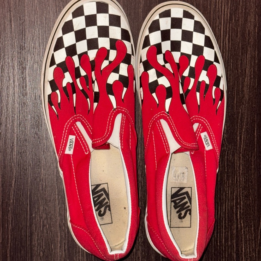 Men’s Vans size 11 slip on sneakers with red, white, and black details.
